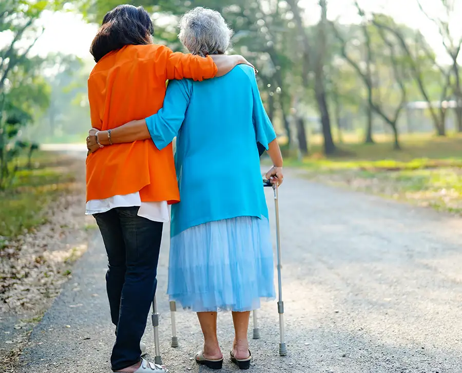 Compassionate care for Elderly clients, Healthcare insurance agent walking with elderly client - St. Charles, MO